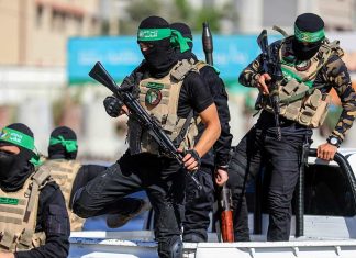 Terrorgram: More evidence of UNRWA support for Hamas Hamas terrorists celebrating the anniversary of kidnapping the body of Israeli soldier Shaul Aron in 2014, July 20, 2022. Photo by Anas-Mohammed/Shutterstock.