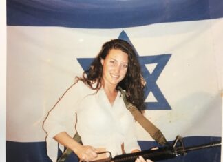 Illinois public defender sues to display photo with gun, Israeli flag in office