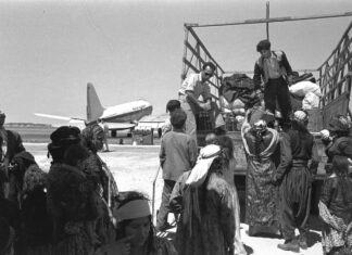Beware distinguished professors rewriting history Luggage is put on trucks to take immigrants from Iraq to a transit camp at Lod Airport on May 1, 1951. Credit: National Photo Collection, GPO.il