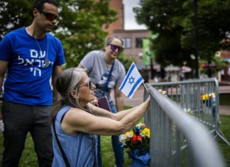 Boulder attacker charged with antisemitic hate crime Lisa Turnquist of Louisville, Colorado, lays flowers and an Israeli flag at the site where 12 people were wounded in a Molotov cocktail attack during a pro-Israel rally outside the Boulder County Courthouse on June 2, 2025. Photo by Chet Strange/Getty Images.