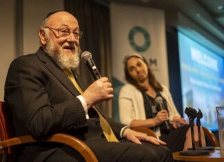 ‘Death to IDF’ chants at UK festival shock local Jews Rabbi Ephraim Mirvis, chief rabbi of the United Hebrew Congregations of the Commonwealth. addressing the Focal Point Conference in New York City alongside OLAM CEO Dyonna Ginsburg, May 2024. Photo by Jesse Kornbluth/OLAM.
