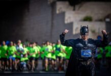 Yoel Levy to run NYC marathon in Batman costume for Bibas family, Holocaust survivors Yoel Levy, known as "the Jewish fitness coach" on social media, running the Jerusalem Marathon in a Batman costume in memory of the Bibas children, who were kidnapped and then killed by Hamas, in Jerusalem, April 4, 2025. Photo by Yonatan Sindel/Flash90.