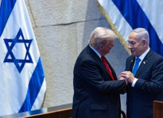 ‘Thank you very much, Bibi. Great job!’ Israeli Prime Minister Benjamin Netanyahu and U.S. President Donald Trump at the Knesset, Oct. 13, 2025. Credit: Yonatan Sindel/Flash90.